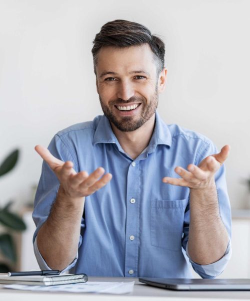 successful-handsome-businessman-sitting-at-desk-in-2022-12-16-07-48-48-utc-2